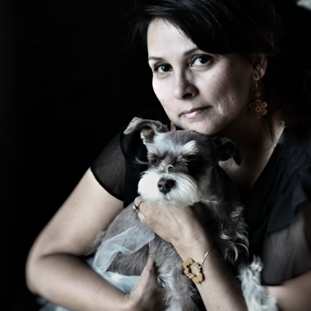 Bella Clay Designs Designer and Operator with her furbaby Bella who inspired the brand name